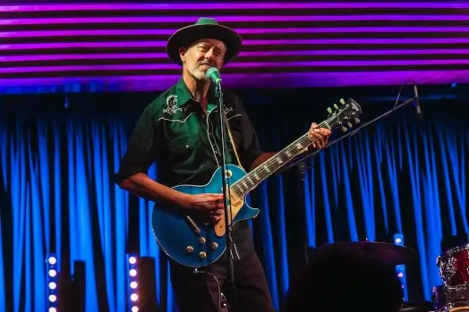 Nathan James playing guitar at Blues Cruise 2026